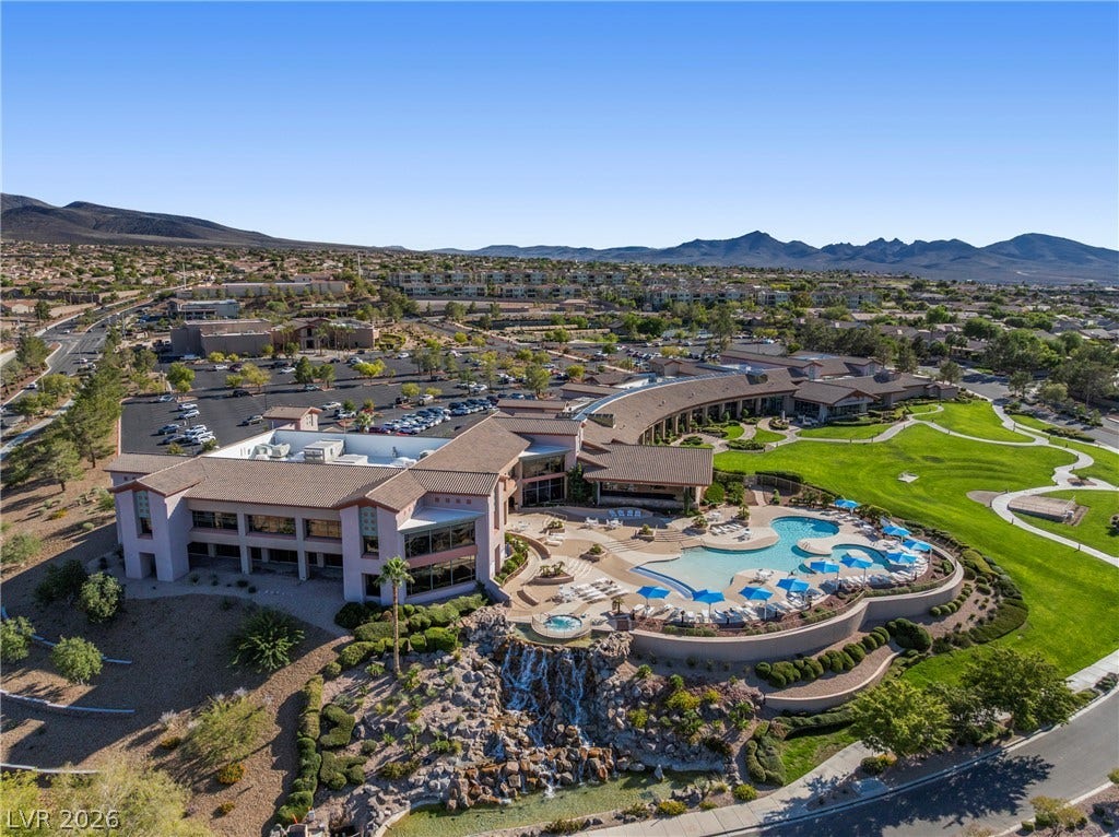 2432 Anderson Park Drive, Henderson, NV 89044 An expansive community complex features resort-style swimming pools set against a dramatic mountain backdrop.