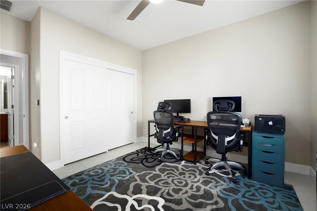 2432 Anderson Park Drive, Henderson, NV 89044 Smooth tile flooring and sliding closet doors define this versatile, light-filled interior space.