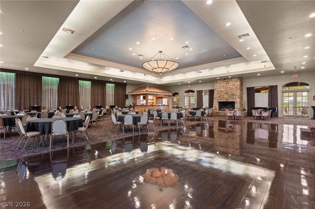 8175 Arville Street, #203, Las Vegas, NV 89139 Polished wood floors and a soaring tray ceiling anchor this grand gathering space.
