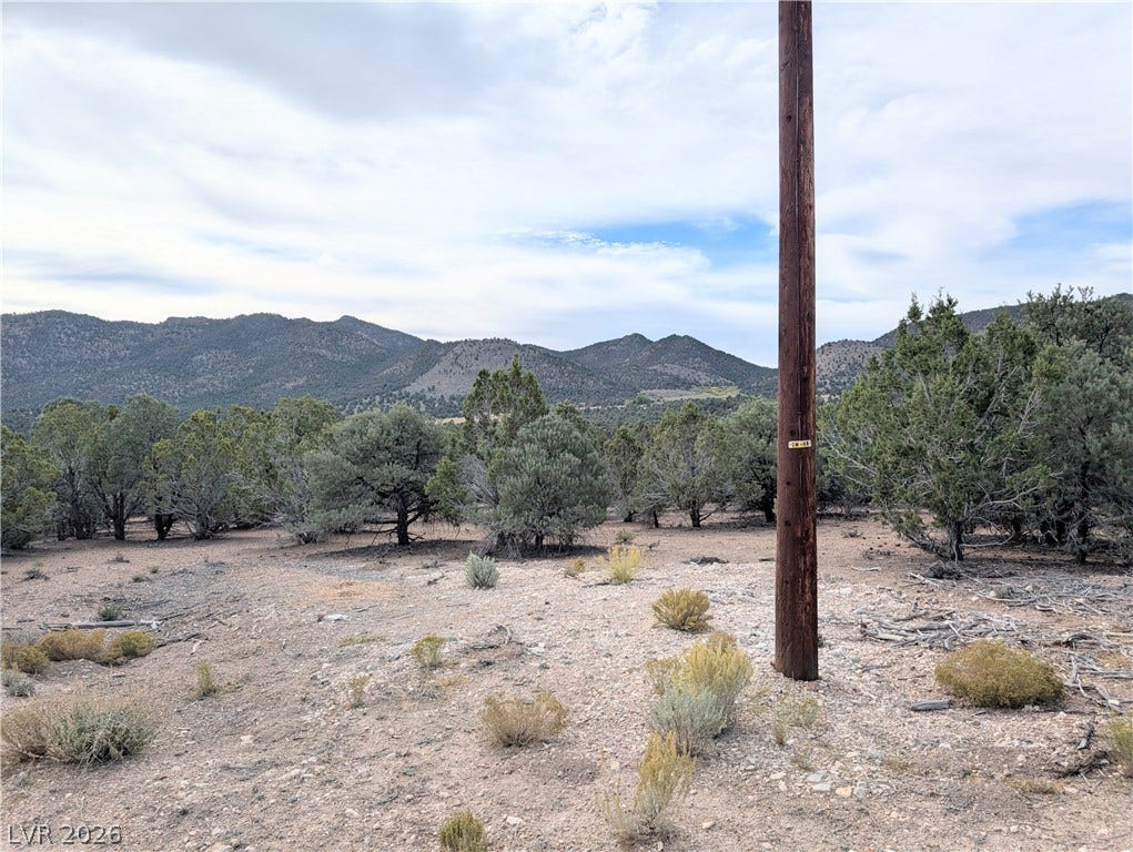 Lot 1-A Side Hill Pass, Pioche, NV 89043 Rolling hills and mature pinon pines frame the scenic mountain views from this elevated terrain.