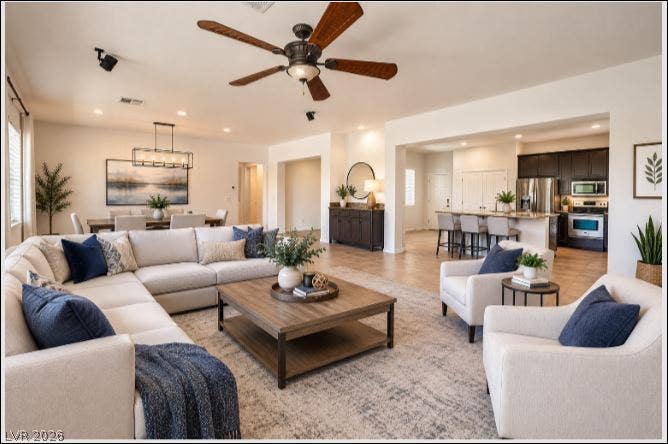 8618 Amber Autumn Street, Las Vegas, NV 89131 Living room virtually staged with modern furniture.
