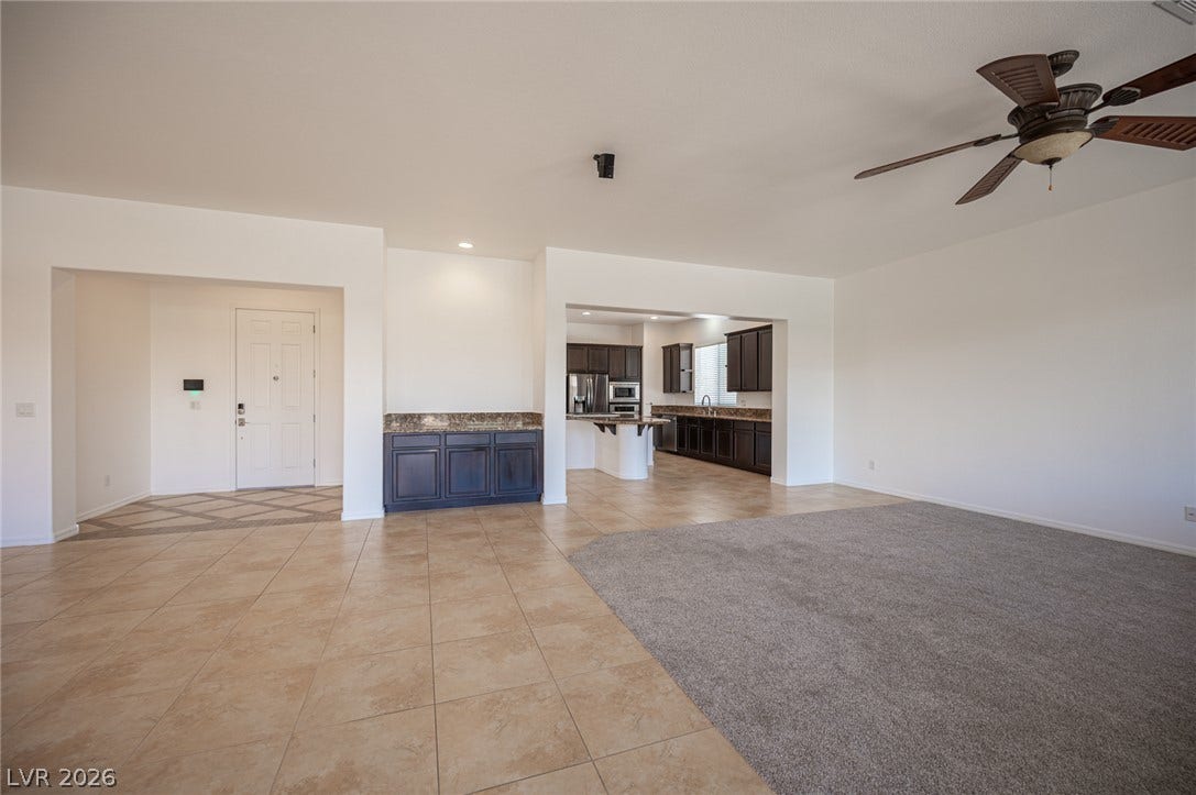 8618 Amber Autumn Street, Las Vegas, NV 89131 An open layout connects the entryway, main living spaces, and kitchen.