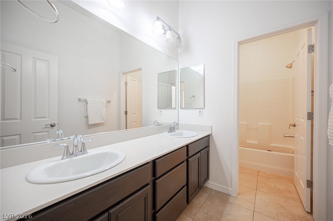 8618 Amber Autumn Street, Las Vegas, NV 89131 Clean lines and a spacious dual vanity define this functional bathroom layout.