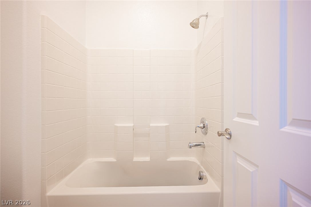 8618 Amber Autumn Street, Las Vegas, NV 89131 Crisp enclose a classic tub and shower combination.