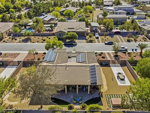 8618 Amber Autumn Street, Las Vegas, NV 89131 Solar panels line the tile roof of this well-positioned suburban home with an expansive lot.