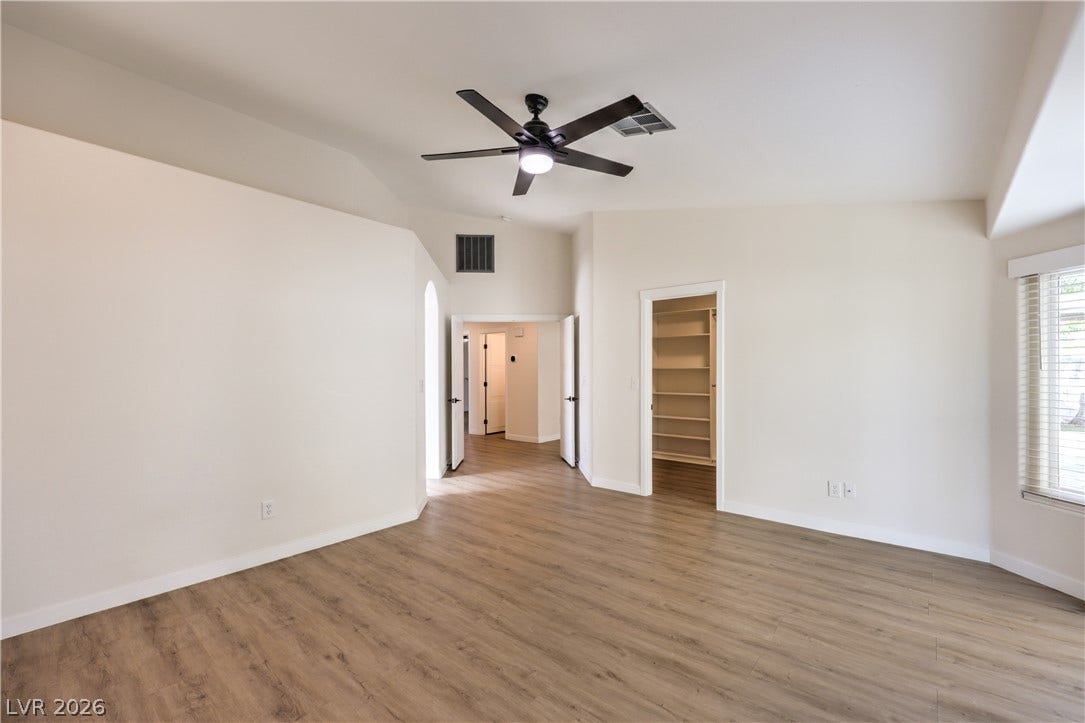 7504 Powder River Court, Las Vegas, NV 89131 Smooth wood floors and vaulted ceilings create an open, airy feeling in this master bedroom.