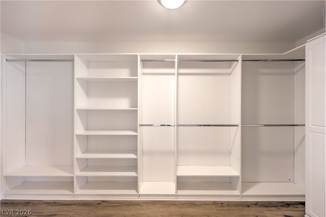 7504 Powder River Court, Las Vegas, NV 89131 Custom built-in shelving and hanging rods maximize storage space above durable wood-look flooring.