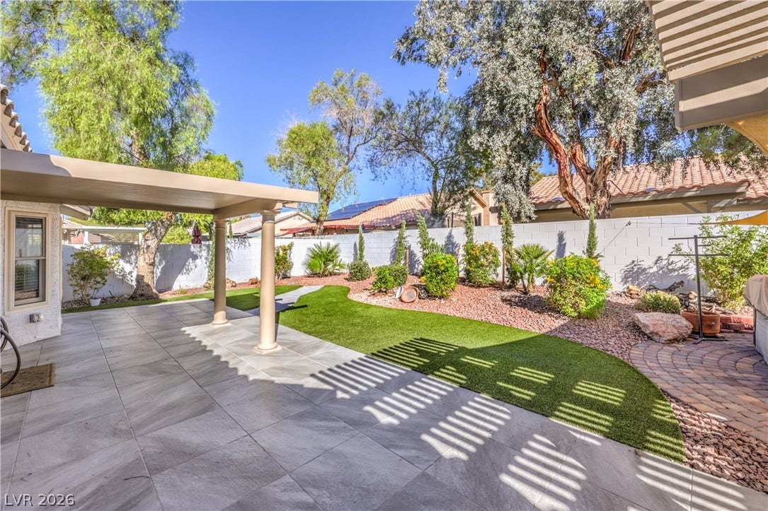 7504 Powder River Court, Las Vegas, NV 89131 A spacious covered patio overlooks the manicured lawn and garden area.