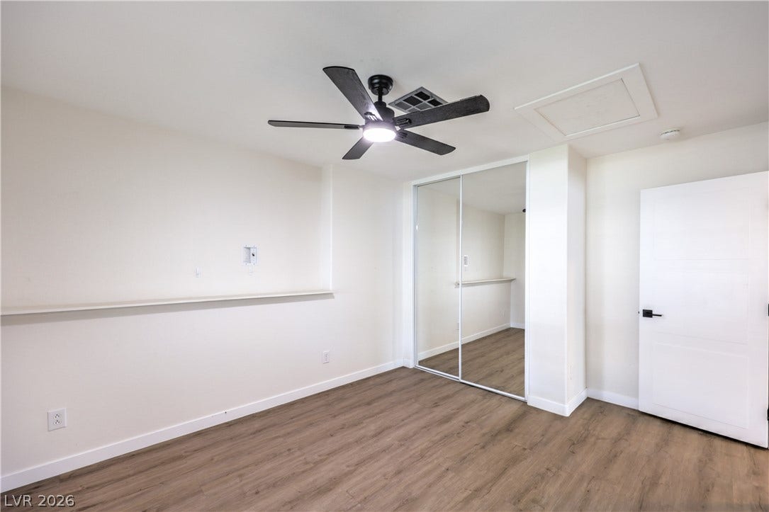7504 Powder River Court, Las Vegas, NV 89131 Smooth wood-style flooring runs through this versatile interior space with built-in ledges.