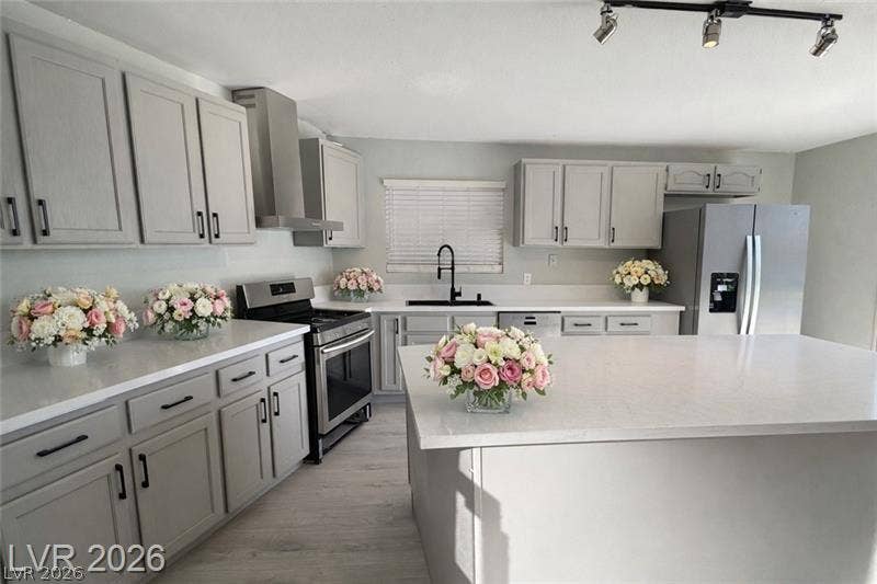 6489 Bugbee Avenue, Las Vegas, NV 89103 Gleaming stone countertops and a spacious central island anchor this beautifully updated workspace.