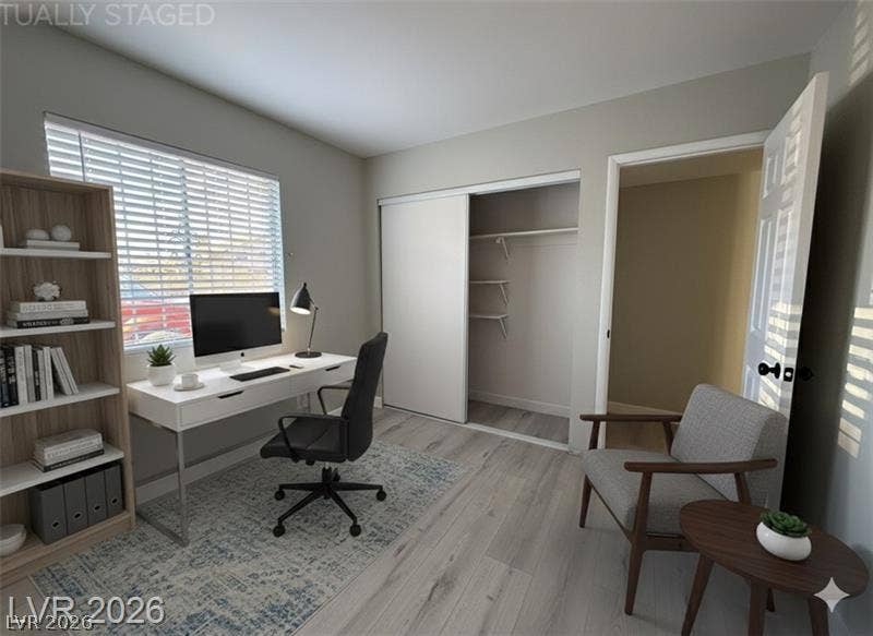 6489 Bugbee Avenue, Las Vegas, NV 89103 Smooth wood-look flooring and integrated closet shelving anchor this versatile secondary space.