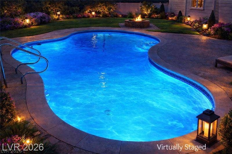 6489 Bugbee Avenue, Las Vegas, NV 89103 An inviting backyard oasis features a glowing pool alongside a stone fire pit.