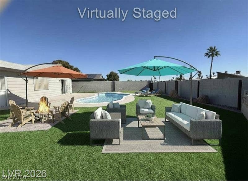 6489 Bugbee Avenue, Las Vegas, NV 89103 An inviting backyard oasis features a shimmering in-ground swimming pool and expansive level lawn.