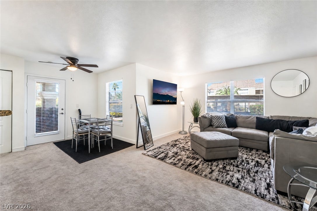 5055 W Hacienda Avenue, #1136, Las Vegas, NV 89118 An open layout connects the comfortable living area and dining space under smooth ceilings.
