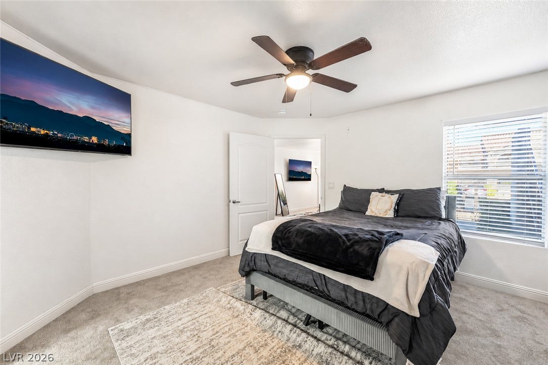 5055 W Hacienda Avenue, #1136, Las Vegas, NV 89118 Plush wall-to-wall carpeting and clean white walls define this comfortable bedroom space.
