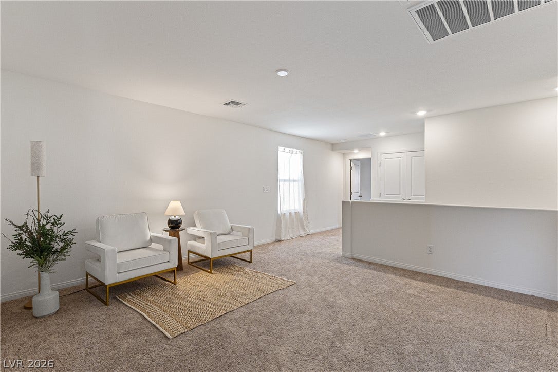 10034 Sir Atlas Court, Las Vegas, NV 89148 An open upstairs landing features comfortable carpeting and recessed lighting.