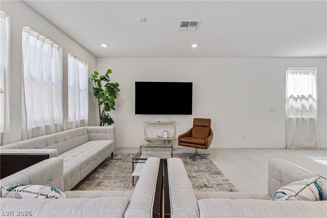 10034 Sir Atlas Court, Las Vegas, NV 89148 Clean lines and smooth tile flooring define this bright, open living space.