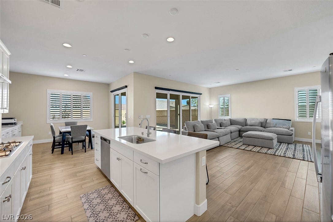 An open floor plan seamlessly connects the kitchen area to the main living space.