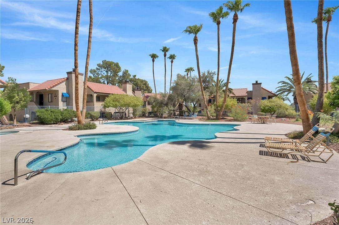 Soak in the sun beside a sparkling community pool lined with towering palm trees.