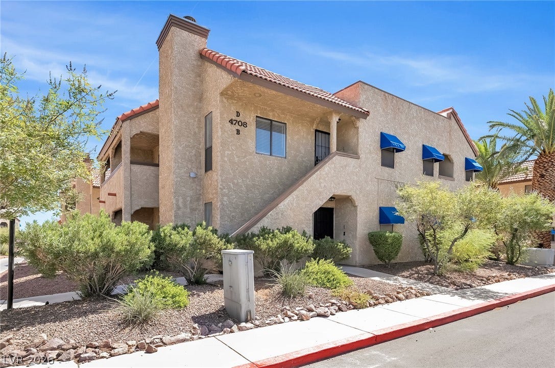 Spanish tile roofing and structured stucco walls define this classic multi-level exterior architecture.