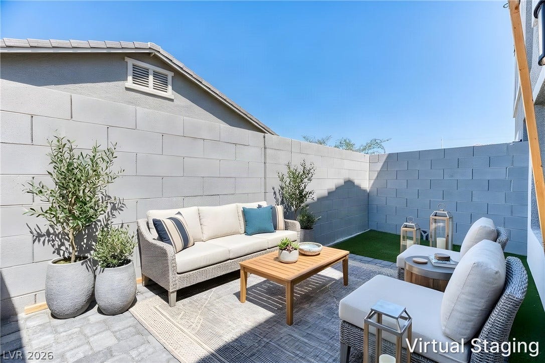 264 Banished Avenue, #2, North Las Vegas, NV 89031 An enclosed paved patio area is bordered by clean, modern block walls.