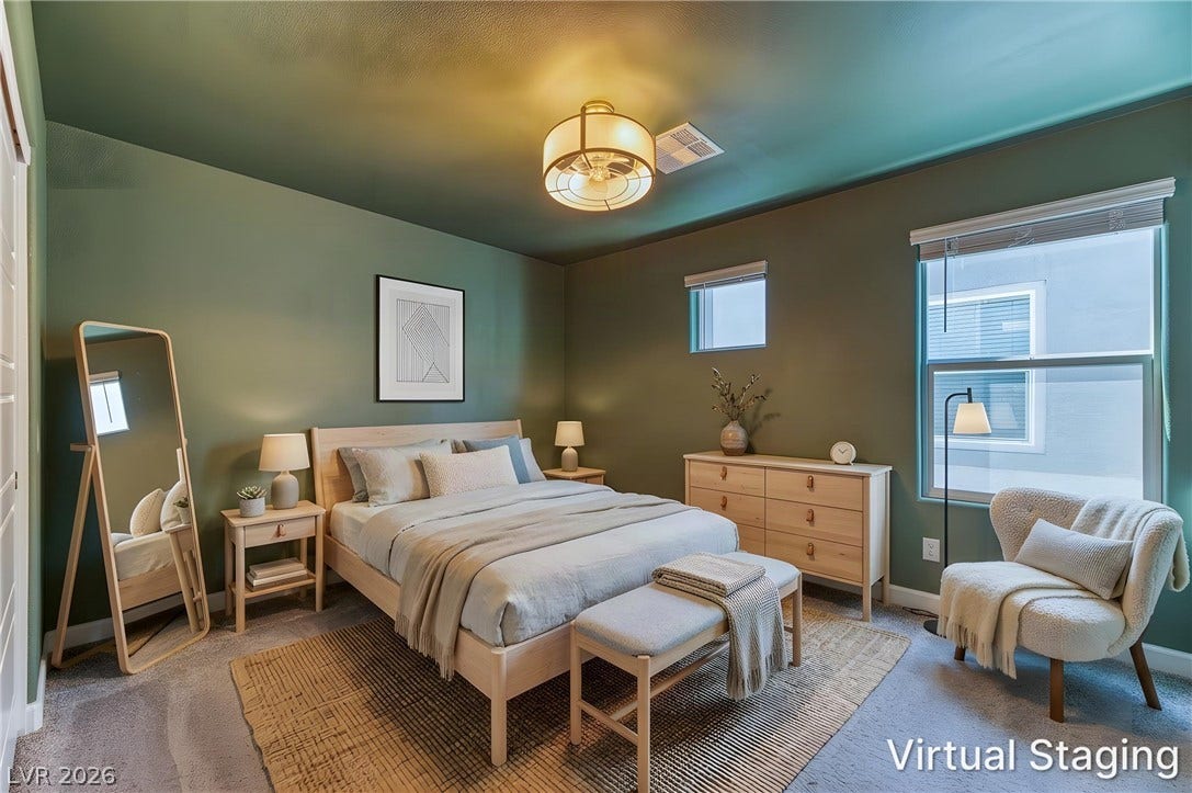 264 Banished Avenue, #2, North Las Vegas, NV 89031 Plush carpeting and large windows create a serene, light-filled atmosphere in this bedroom.