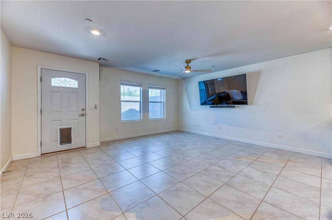 264 Banished Avenue, #2, North Las Vegas, NV 89031 Durable tile flooring and recessed lighting define this versatile main living area.