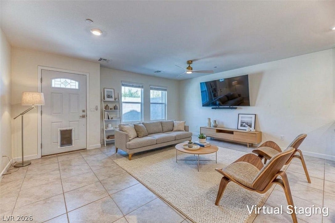 264 Banished Avenue, #2, North Las Vegas, NV 89031 Tiled flooring and large windows enhance this welcoming living space.