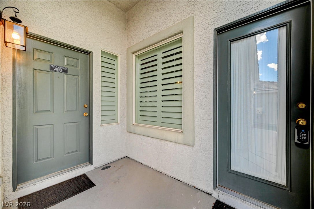 ONE Door is for CASITA.      stucco walls and integrated exterior lighting.