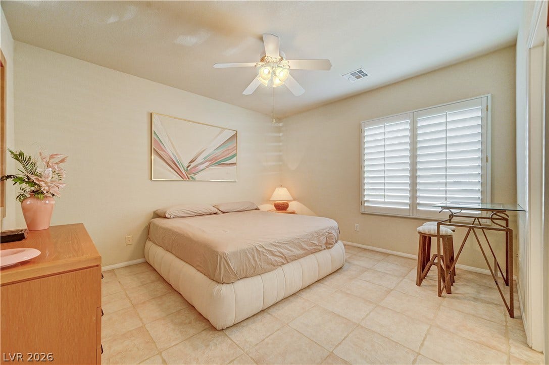 CASITA BEDROOM  Tiled flooring and plantation shutters define this serene bedroom space.