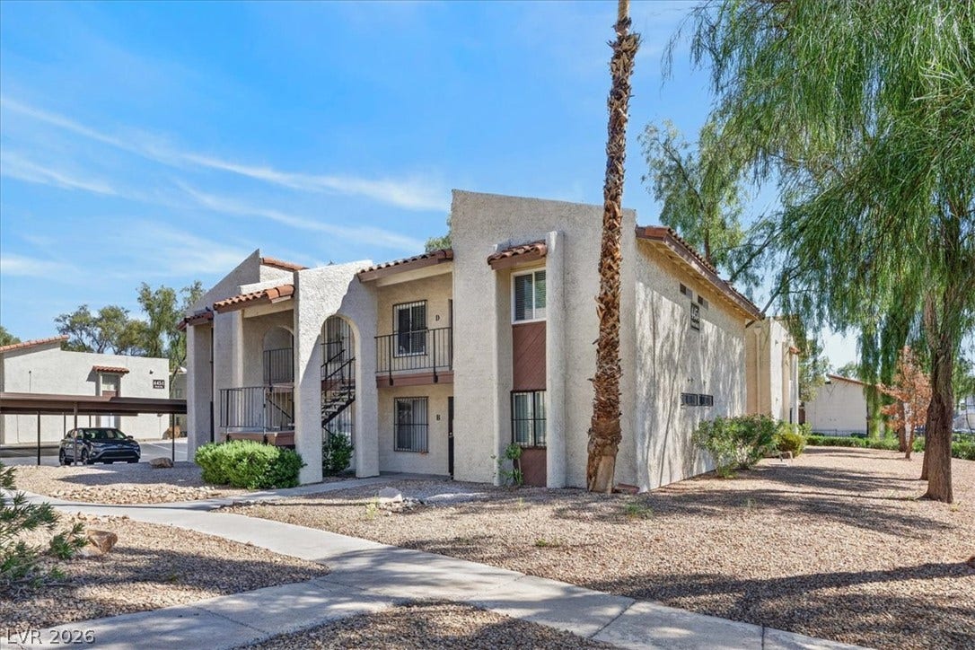 4454 W Desert Inn Road, #D, Las Vegas, NV 89102 Spanish tile accents and a textured stucco exterior define this multi-level residential building.