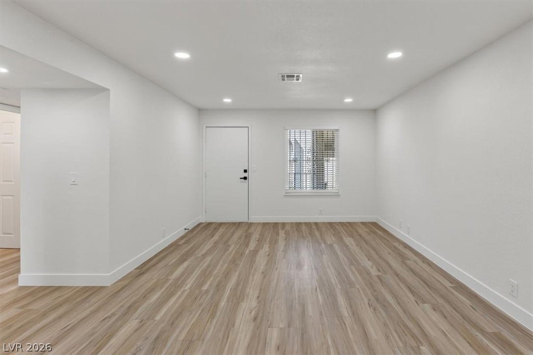 4454 W Desert Inn Road, #D, Las Vegas, NV 89102 Gleaming wood-look floors complement clean white walls and recessed lighting in this versatile space.