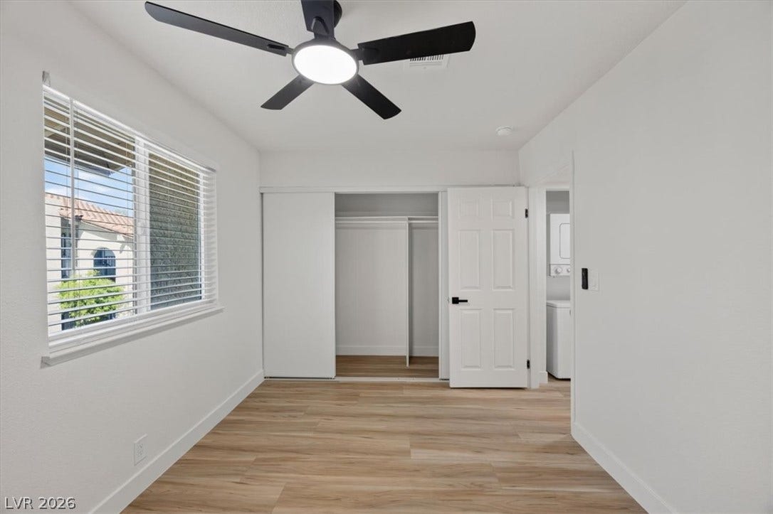 4454 W Desert Inn Road, #D, Las Vegas, NV 89102 Smooth wood floors and crisp white walls define this versatile secondary space.