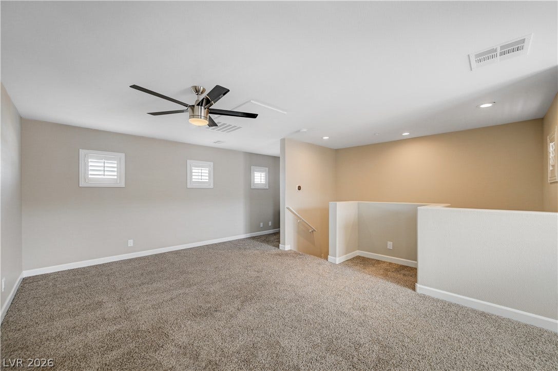 1525 Spiced Wine Avenue, #3105, Henderson, NV 89074 Plush carpeting and high ceilings define this versatile upper-level loft area.