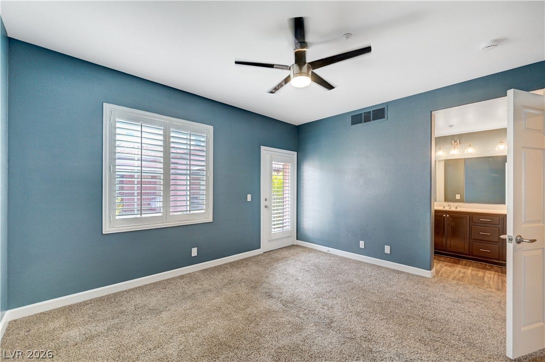 1525 Spiced Wine Avenue, #3105, Henderson, NV 89074 Richly textured carpeting and clean baseboards ground this inviting bedroom retreat.