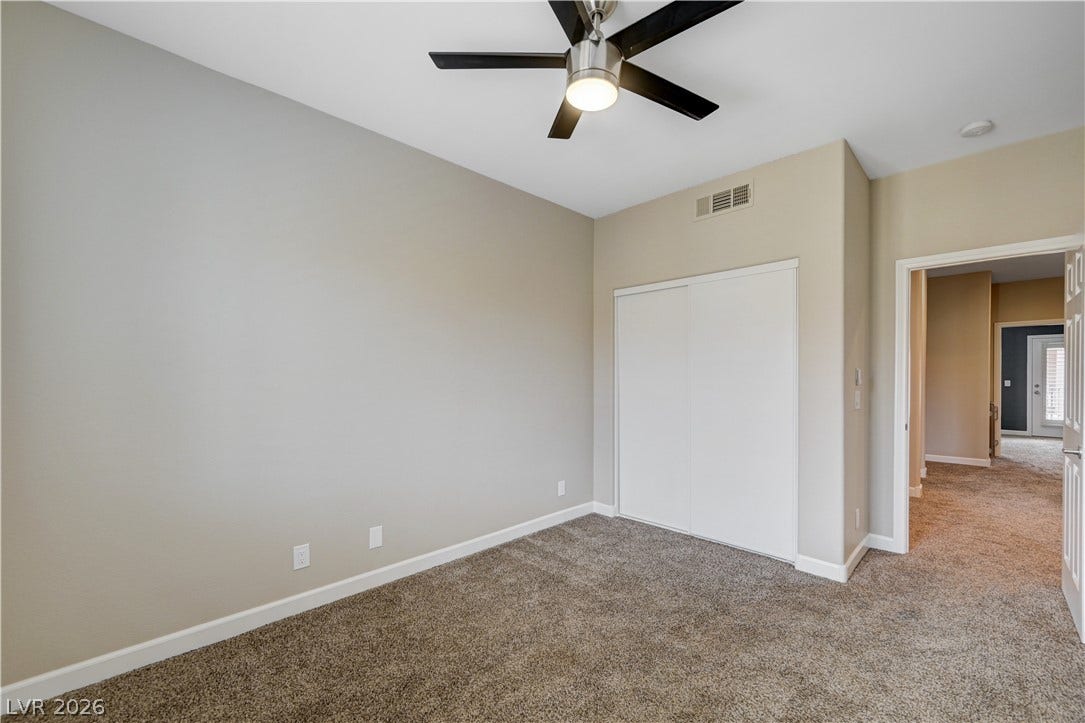 1525 Spiced Wine Avenue, #3105, Henderson, NV 89074 Soft carpeting pairs with neutral walls in this versatile secondary bedroom space.