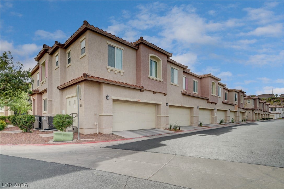 1525 Spiced Wine Avenue, #3105, Henderson, NV 89074 Stucco exteriors paired with tile roofing define the elegant architectural style of this residential complex.