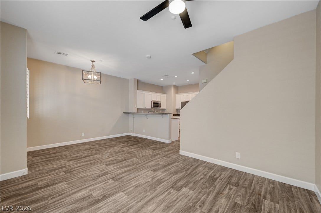 1525 Spiced Wine Avenue, #3105, Henderson, NV 89074 Warm wood-look flooring anchors a versatile dining area adjacent to the open-concept kitchen.