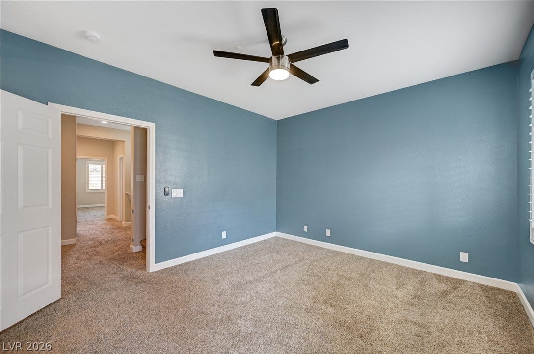 1525 Spiced Wine Avenue, #3105, Henderson, NV 89074 Plush carpet underfoot anchors this quiet space with smooth walls and clean baseboard trim.