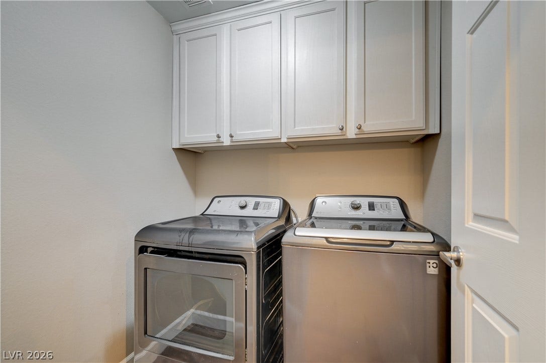 1525 Spiced Wine Avenue, #3105, Henderson, NV 89074 Ample built-in cabinetry provides essential storage above the washer and dryer connections.
