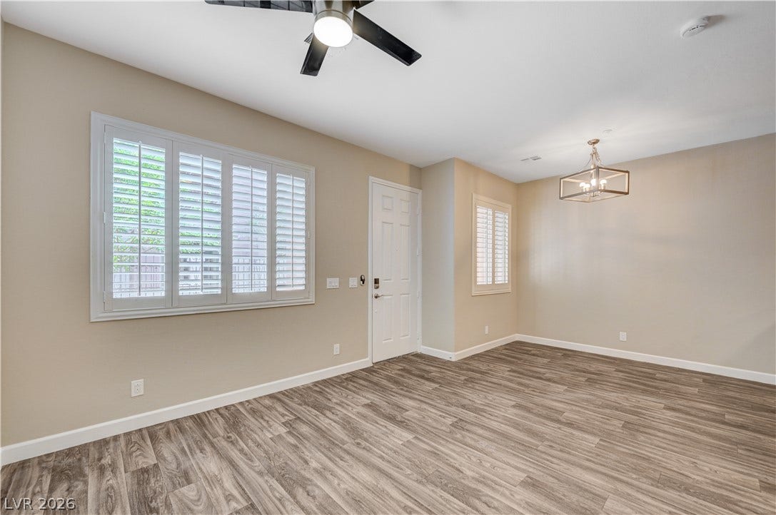 1525 Spiced Wine Avenue, #3105, Henderson, NV 89074 Rich wood-inspired flooring and timeless plantation shutters frame this versatile open-concept entry space.
