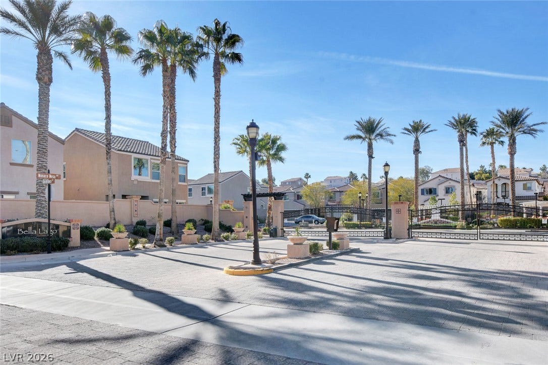 1525 Spiced Wine Avenue, #3105, Henderson, NV 89074 Palm trees frame the secure gated entrance to this neighborhood community.