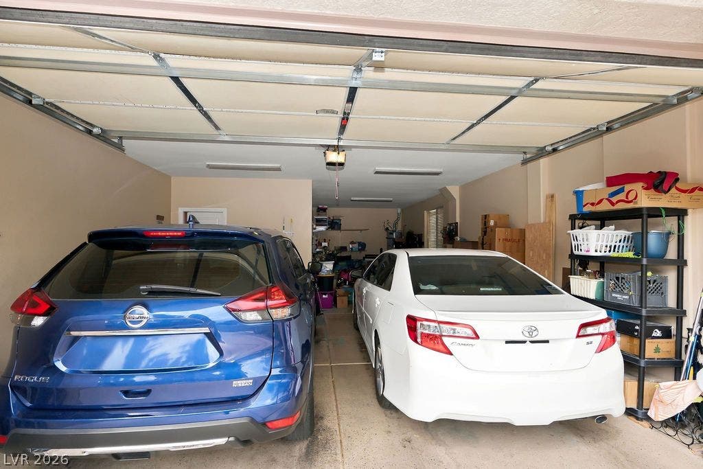An attached multi-car garage provides substantial parking space and convenient home access.