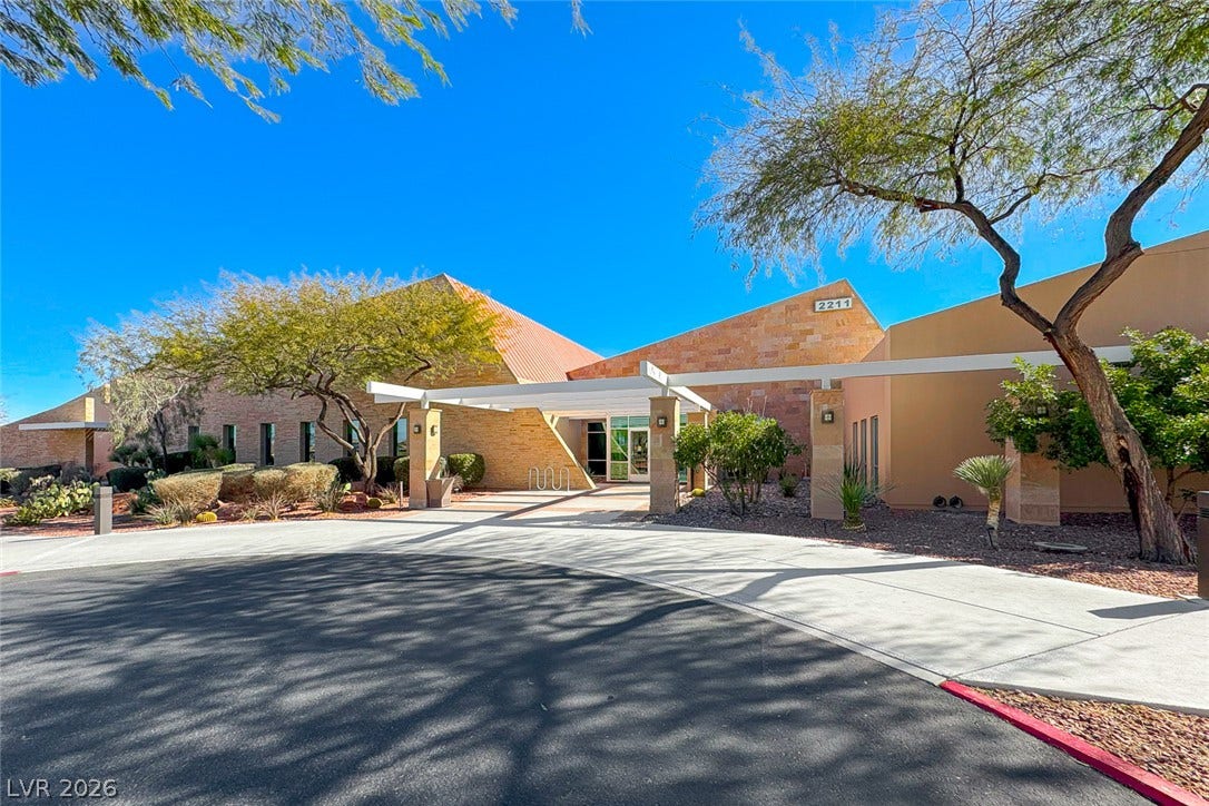 2601 Arimo Drive, Henderson, NV 89052 Striking desert architecture defines this welcoming modern entrance with stone accents.