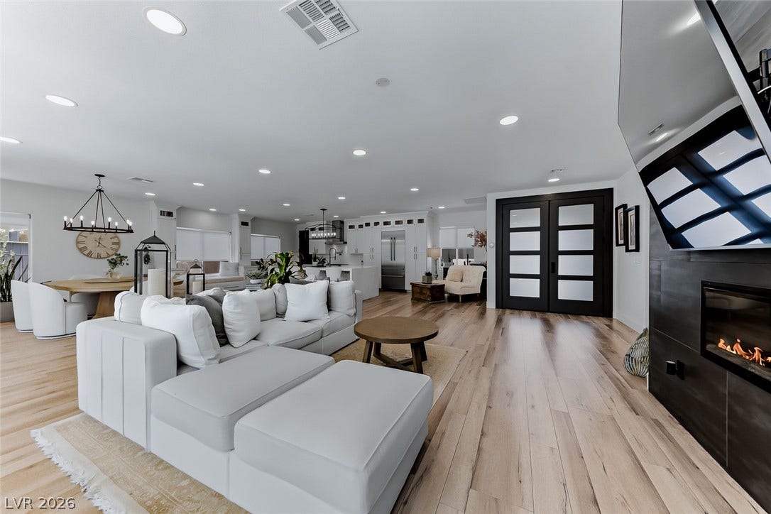 2601 Arimo Drive, Henderson, NV 89052 Elegant wood floors flow seamlessly through this light-filled, open-concept living area.