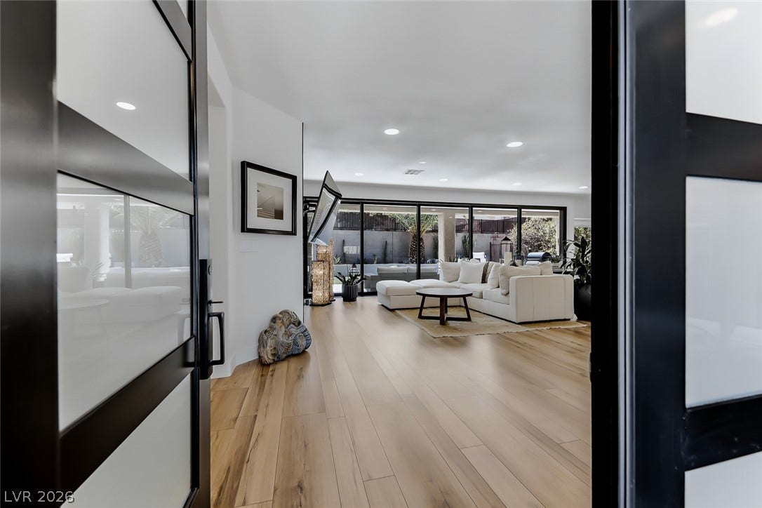 2601 Arimo Drive, Henderson, NV 89052 An inviting entrance foyer reveals rich hardwood floors and seamless connections to the living spaces.