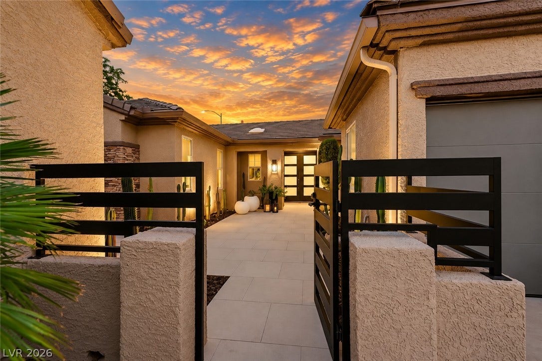2601 Arimo Drive, Henderson, NV 89052 A gated entry path paved in light stone leads to the inviting double front doors.