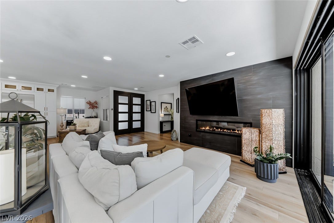 2601 Arimo Drive, Henderson, NV 89052 An inviting fireplace serves as the focal point of this open living space.