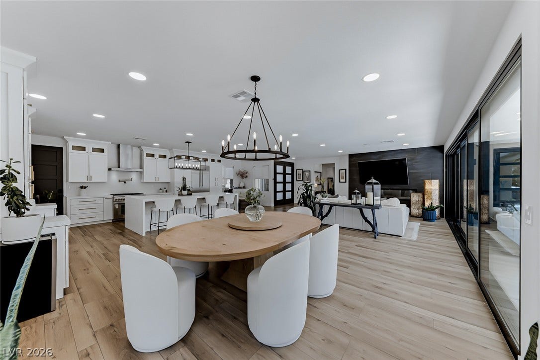 2601 Arimo Drive, Henderson, NV 89052 Plank flooring sweeps through this open concept living, dining, and kitchen space with recessed lights.
