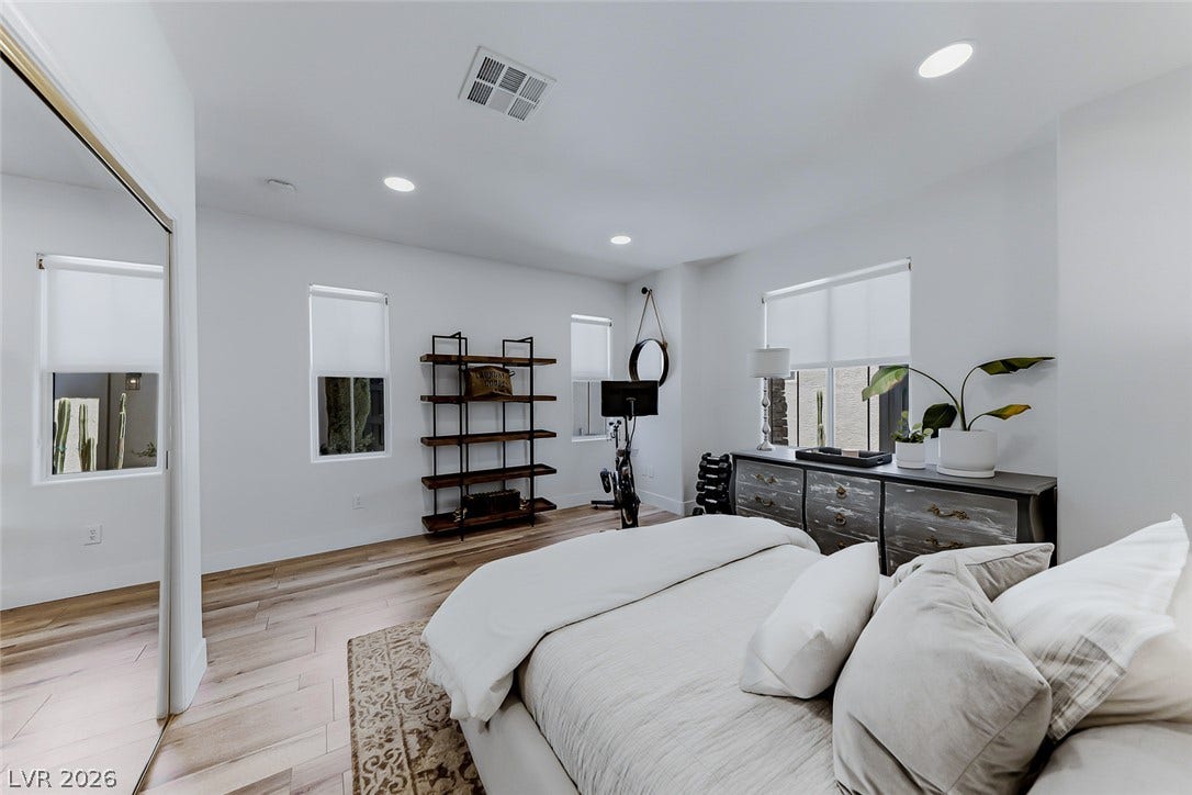 2601 Arimo Drive, Henderson, NV 89052 Smooth wood floors and recessed lighting enhance this tranquil sleeping space.